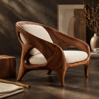 Corner detail of shell back chair with oval side openings and splayed legs beside wood, brass and linen samples
