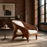 Shell back chair with oval side openings and splayed legs in an industrial loft living room with exposed brick