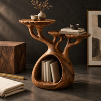 Corner detail of tree form wood side table with three tops and a hollow base beside wood, brass and linen samples