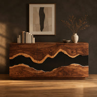 Sideboard with three tall doors and a dark wavy band across the front in a dark studio against a charcoal plaster wall