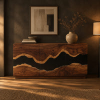 Sideboard with three tall doors and a dark wavy band across the front in a dark dining room at golden hour