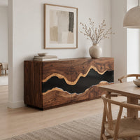 Sideboard with three tall doors and a dark wavy band across the front in a Scandinavian dining room with white walls