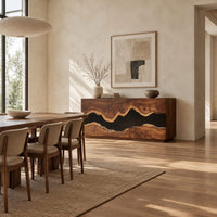 Sideboard with three tall doors and a dark wavy band across the front in a bright open plan dining room