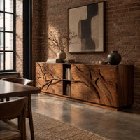 Low sideboard with carved branch doors and an open center bay in an industrial loft dining room with exposed brick