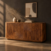 Sideboard with fluted arch carving and rounded ends, three-quarter view showing the grain