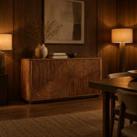 Sideboard with fluted arch carving and rounded ends in an evening dining room with walnut wall paneling
