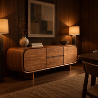 Long sideboard with soft oval ends and a four panel front in an evening dining room with walnut wall paneling