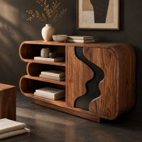 Corner detail of sideboard with three stacked open shelves and a black wave inlay door beside wood, brass and linen samples