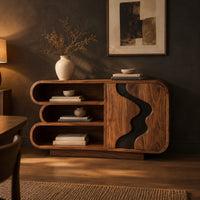 Sideboard with three stacked open shelves and a black wave inlay door in a dark dining room at golden hour