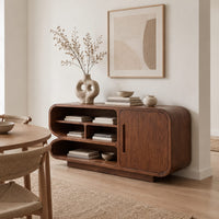 Sideboard with three tiers of open shelves beside a single slot pull door in a Scandinavian dining room with white walls