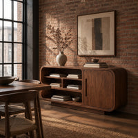 Sideboard with three tiers of open shelves beside a single slot pull door in an industrial loft dining room with exposed brick