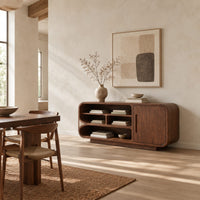 Sideboard with three tiers of open shelves beside a single slot pull door in a bright open plan dining room