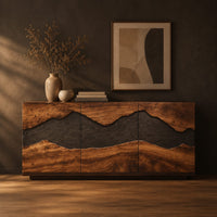 Boxy wooden sideboard with a wavy dark band across three front panels in a dark studio against a charcoal plaster wall