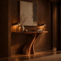 Console table on a single sculpted pedestal that twists up to the top in an evening entryway with walnut wall paneling