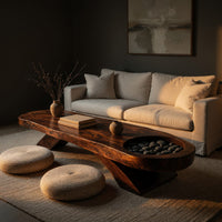 Long dark slab coffee table with a carved bowl in a living room at golden hour