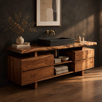 Slab top bathroom vanity with two drawer stacks and an open towel shelf, three-quarter view showing the grain