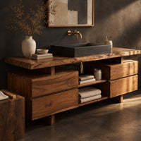 Corner detail of slab top bathroom vanity with two drawer stacks and an open towel shelf beside wood, brass and linen samples