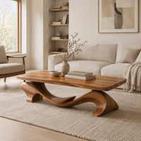 Slab top coffee table on a swooping wave shaped base in a Scandinavian living room with white walls