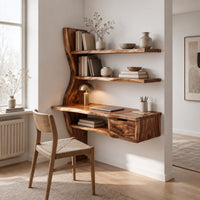 Wooden desk with a slab top, wavy side upright, two shelves and a drawer in a Scandinavian home office with white walls