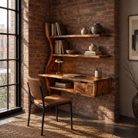 Wooden desk with a slab top, wavy side upright, two shelves and a drawer in an industrial loft home office with exposed brick
