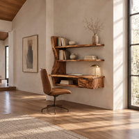 Wooden desk with a slab top, wavy side upright, two shelves and a drawer in a bright open plan home office