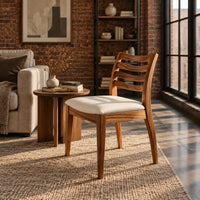Dining chair with a slatted back and an upholstered seat in an industrial loft living room with exposed brick