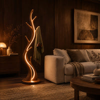 Slim floor lamp shaped like a branching tree with glowing lines in an evening living room with walnut wall paneling