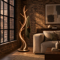 Slim floor lamp shaped like a branching tree with glowing lines in an industrial loft living room with exposed brick