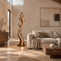 Slim floor lamp shaped like a branching tree with glowing lines in a bright open plan living room