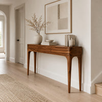 Slim console table with three front panels and tapered legs in a Scandinavian entryway with white walls