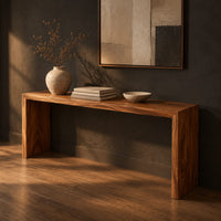 Slim waterfall console table with a smooth top and two wide slab legs, three-quarter view showing the grain