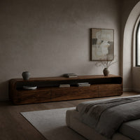TV console with an open top slot over three drawers in a concrete and timber loft