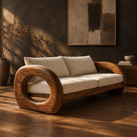 Wood sofa with open ring arms and two wide seat cushions, three-quarter view showing the grain