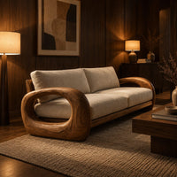 Sofa with thick open loop wooden arms and two seat cushions in an evening living room with walnut wall paneling