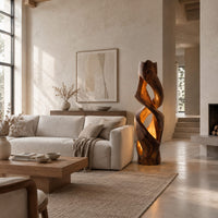 Floor lamp carved as a twisting solid column with glowing cutouts in a bright open plan living room