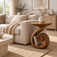 Round side table with a swirling stem and a coiled spiral base in a Scandinavian living room with white walls