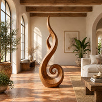 Flame shaped sculpture with an open center and a spiral curl at the base in a bright living room with arched windows and plants