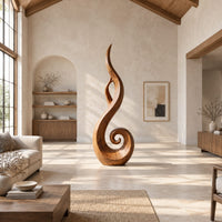 Flame shaped sculpture with an open center and a spiral curl at the base in a bright open plan living room
