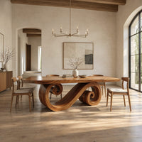 Rectangular dining table with a thick plank top and a spiral ribbon pedestal in a bright open plan dining room