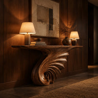 Console table on a single spiral scroll base with fanned carved ridges in an evening entryway with walnut wall paneling