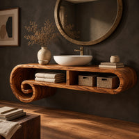 Corner detail of floating scroll shelf vanity cabinet with two open compartments and curled ends beside wood, brass and linen samples