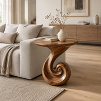 Scroll base side table with a circular top and spiral foot in a Scandinavian living room with white walls