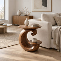 Spiral side table with a curled base and a small lower shelf in a Scandinavian living room with white walls