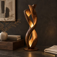 Corner detail of twisted floor lamp with spiral wood ribbons and a warm inner glow beside wood, brass and linen samples