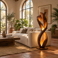 Twisted floor lamp with spiral wood ribbons and a warm inner glow in a bright living room with arched windows and plants