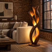 Twisted floor lamp with spiral wood ribbons and a warm inner glow in an industrial loft living room with exposed brick