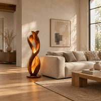 Twisted floor lamp with spiral wood ribbons and a warm inner glow in a bright open plan living room