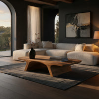 Pale splayed leg coffee table in a living room at golden hour
