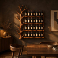 Tree shaped wine rack with four long shelves and a branching left side in a dark dining room at golden hour