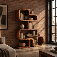 Stacked loop bookshelf with offset open cubbies on a flat base in an industrial loft living room with exposed brick